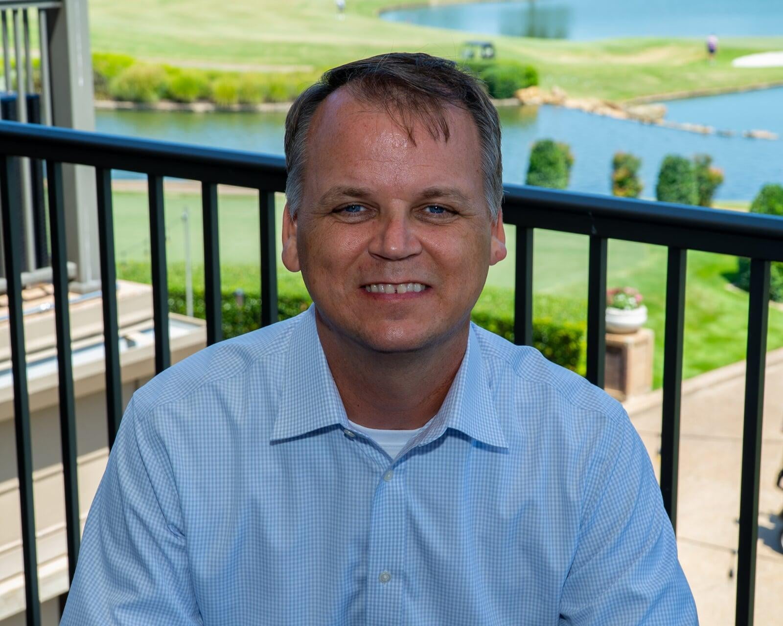 Greg T. Dunavant, seated outdoors